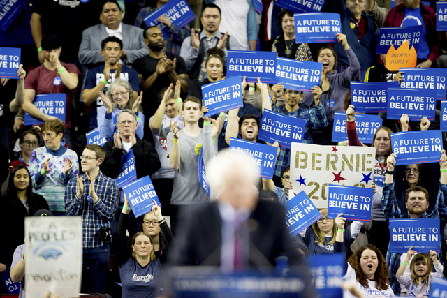 Bernie Sanders supporters cheer for the presidential candidate during a rally in Seattle on March 20, 2016.