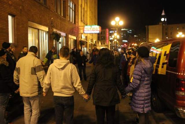 Rescue van volunteers pray outside Union Gospel Mission. Photo by Casey Jaywork. (details)