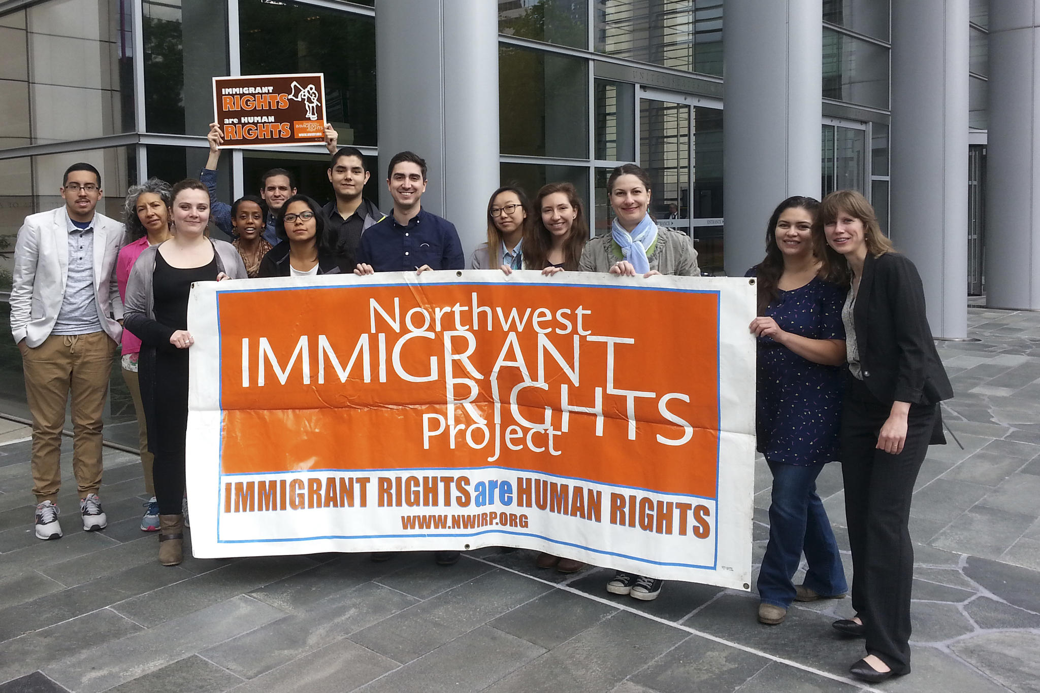 Immigrant rights advocates gather at a press conference downtown. Photo by Casey Jaywork.