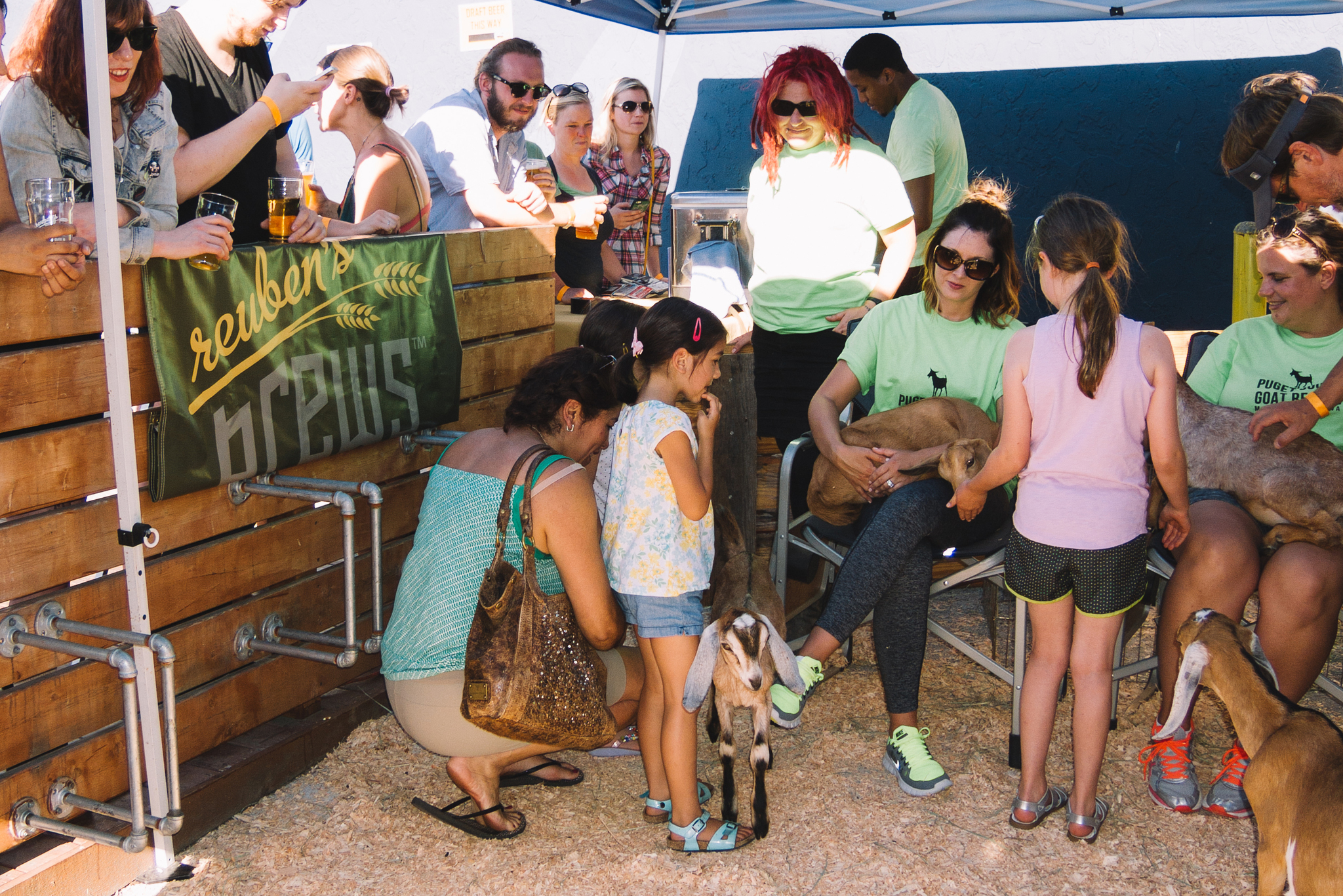 Seattle Lines Up To Drink Beer and Pet Small Goats