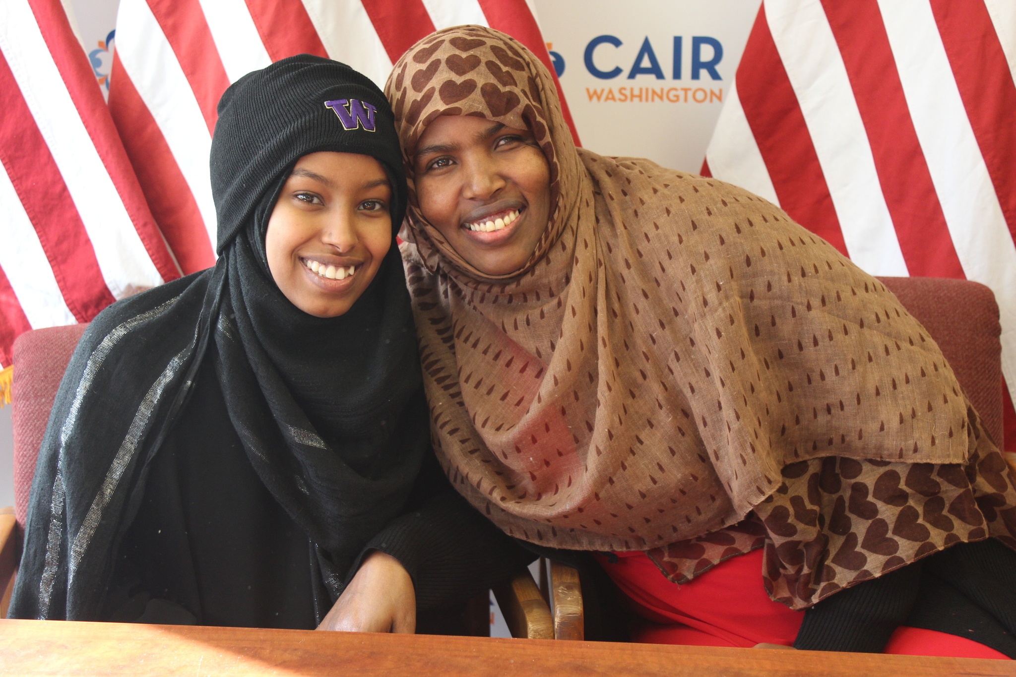 Nasro Hassan, 18, and her mother, Dahabo Hassan, speak in the CAIR-WA office Tuesday. Photo by Sara Bernard.