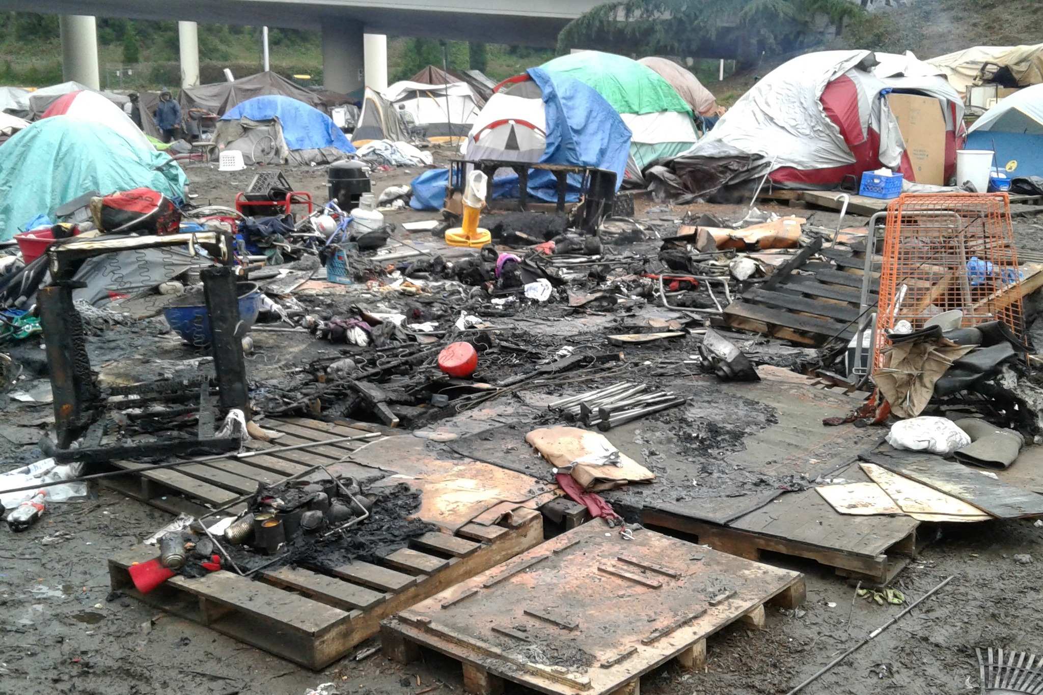 The remains of a fire at the Field homeless encampment on February 11, 2017. Photo by Cory Potts.