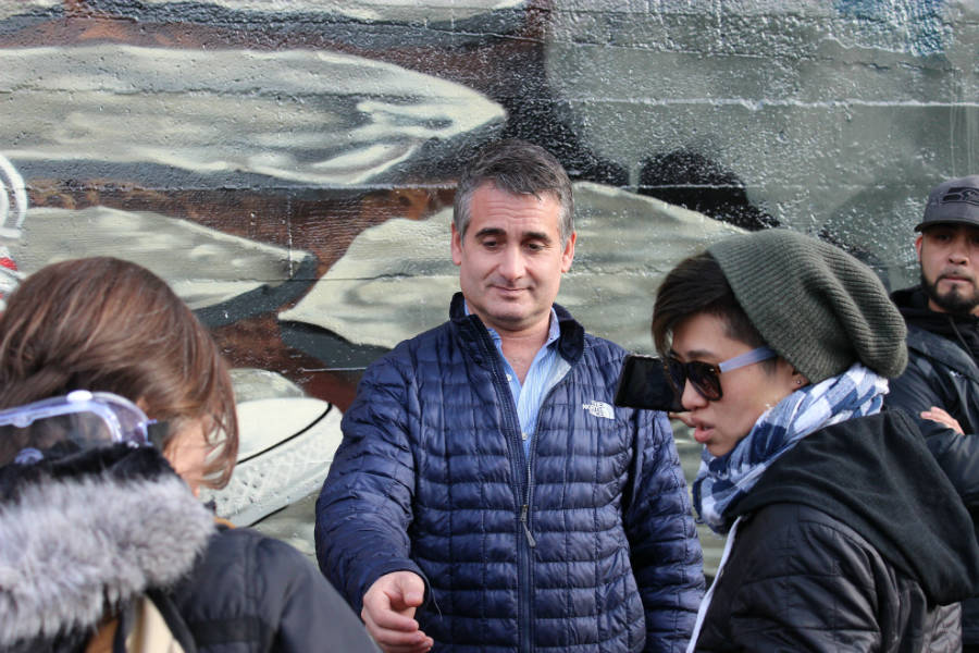 Ian Eisenberg talks with protesters outside his shop last year. Photo by Casey Jaywork.