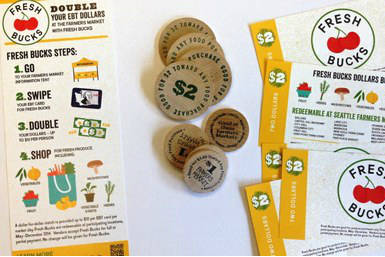 Coupons used by poor people in the Fresh Bucks program to buy produce. Image via SeattleFarmersMarkets.org.