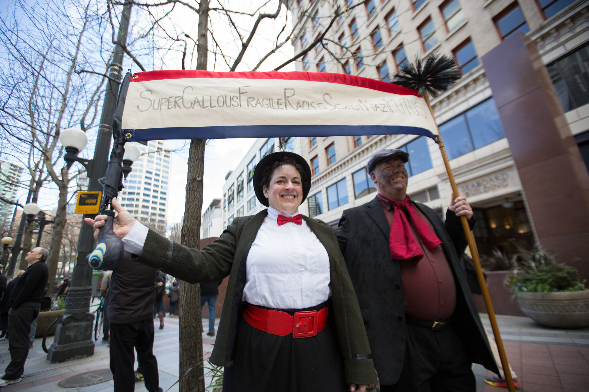 Bree Fish, left and John Kohlsaat came from Everett to protest. “We want to let people know that we care and that we’re aware and we will continue to resist and fight,” John said.