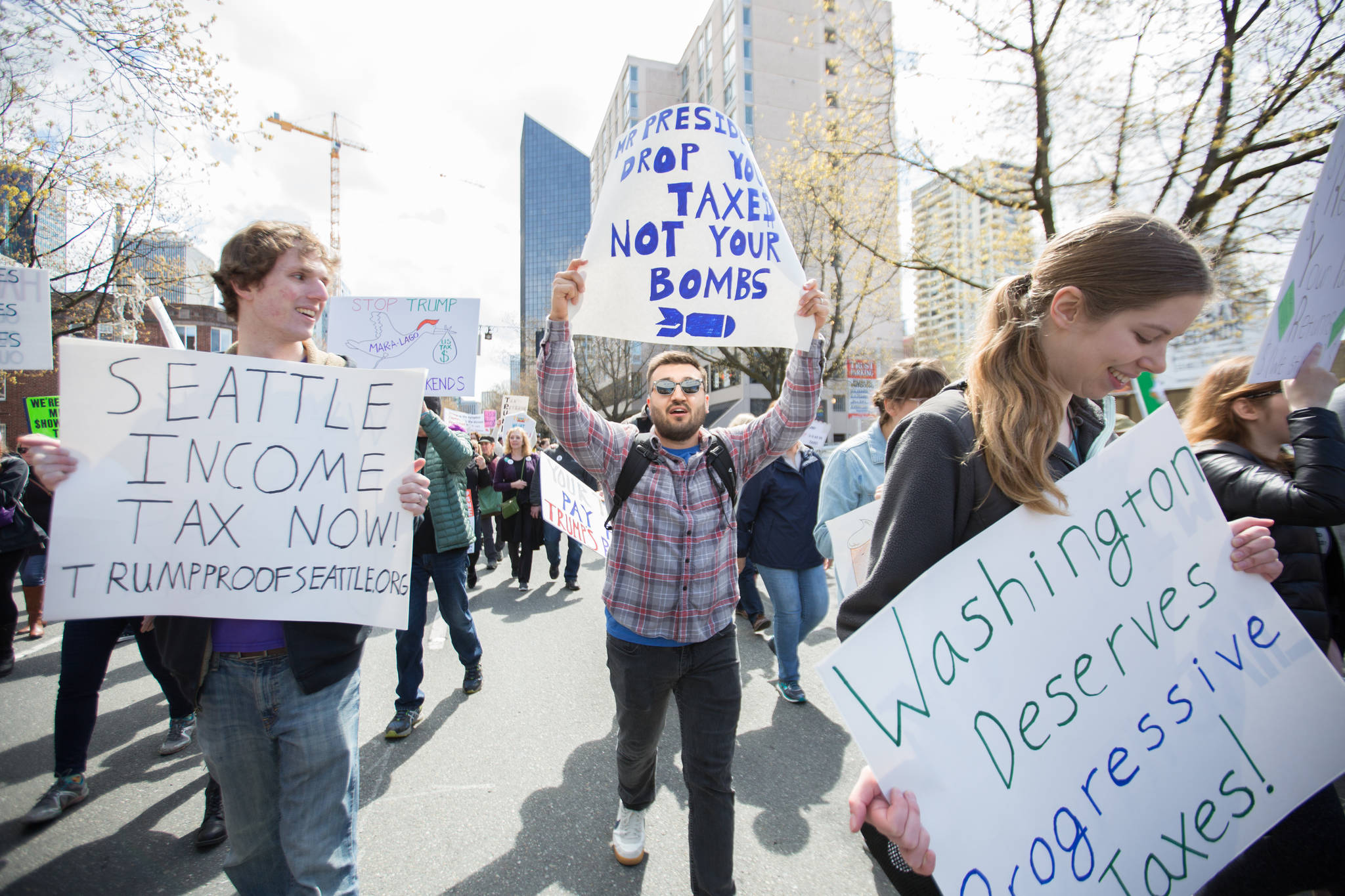 “I can’t stand what he’s getting by with,” Kent Westbrook, center, said. “He’s double dipping off of everything. He’s making money off of us, the taxpayers, laughing at us. I’m so appalled by everything that I have to be out here.”