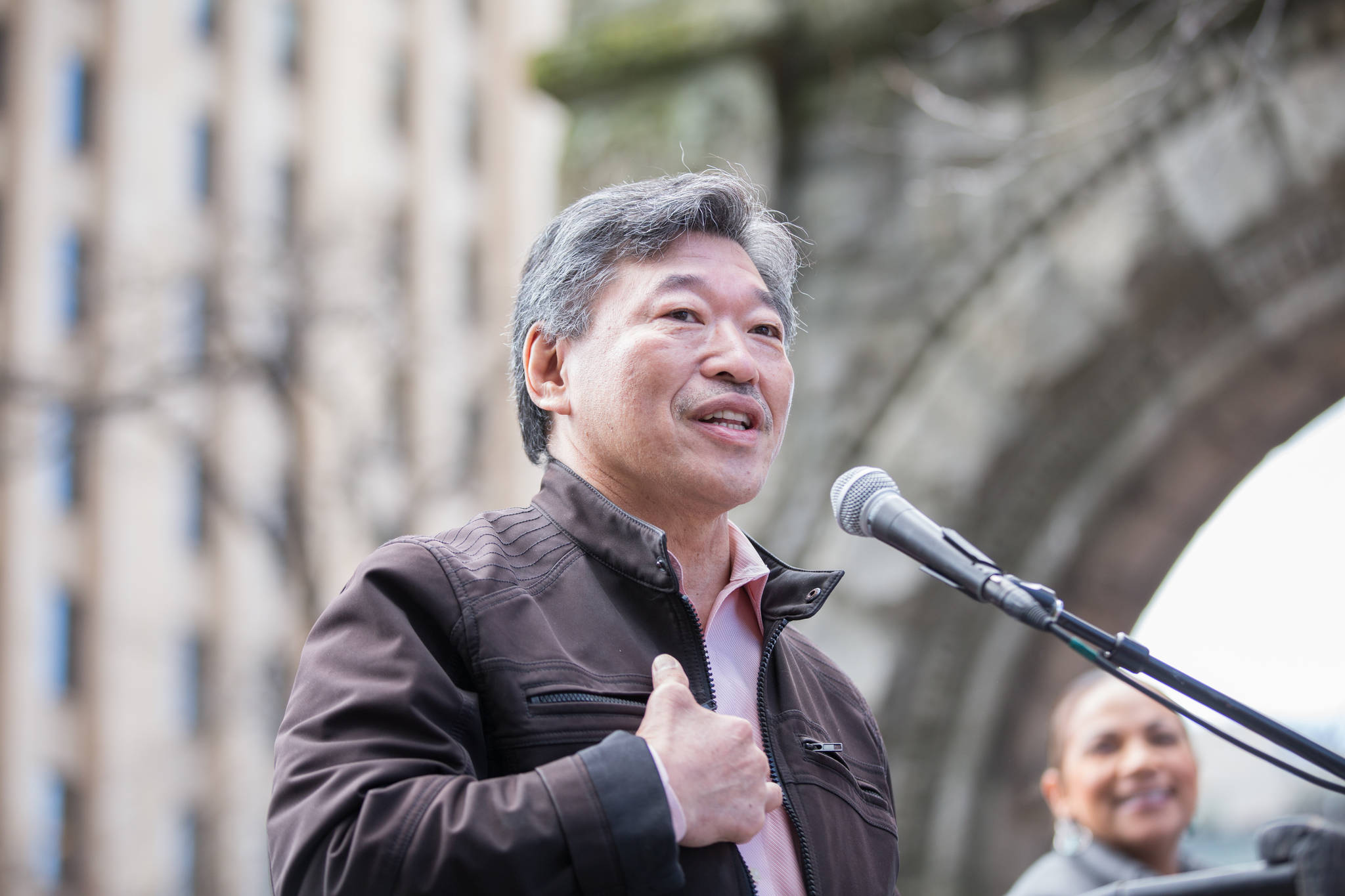 Bob Hasegawa speaking at the Tax Day rally in Seattle this year. He said: “We need to have a statewide conversation about comprehensive, progressive tax reform. It includes talking about a progressive income tax. Those who get the most out of society, are morally and socially obligated to put the most back into society so we can build a society that lifts all of us up, not just a few at the expense of the rest of us.” Photo by Alex Garland