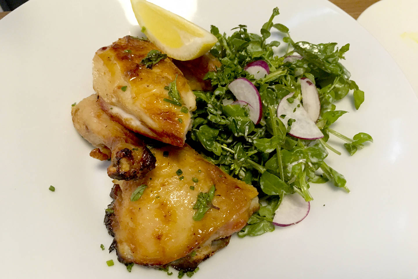 Roasted chicken with watercress and wild radish salad. Photo by Nicole Sprinkle