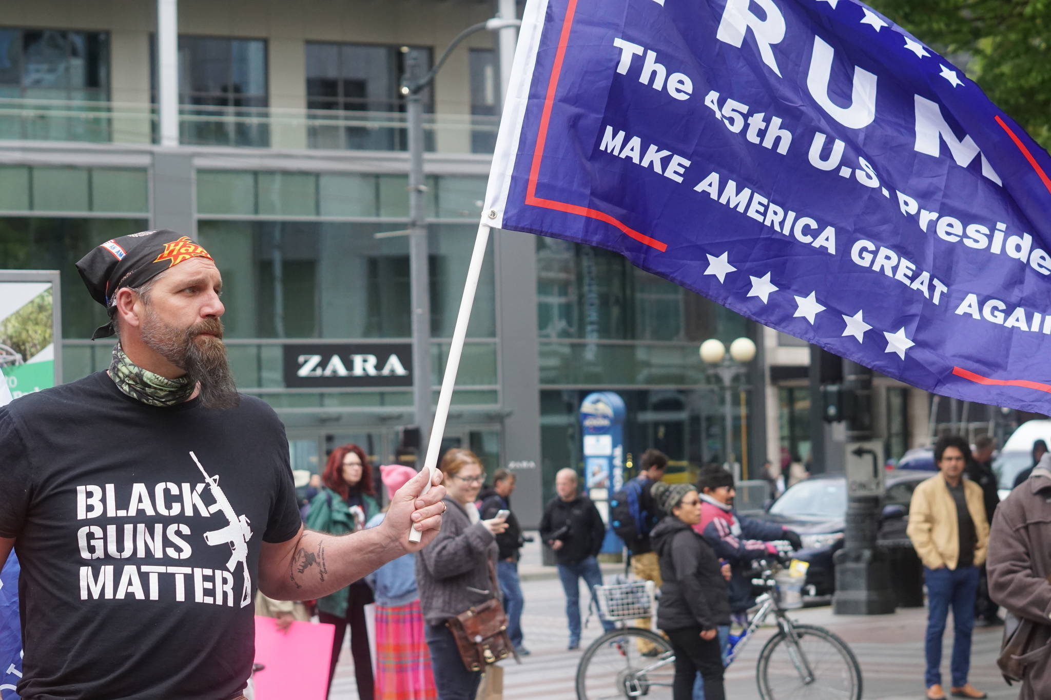 Activists on the right have made their presence known in liberal bastions like Seattle recently. This man turned out for the May 1 Immigrant Rally at Westlake Park. Photo by Agatha Pacheco