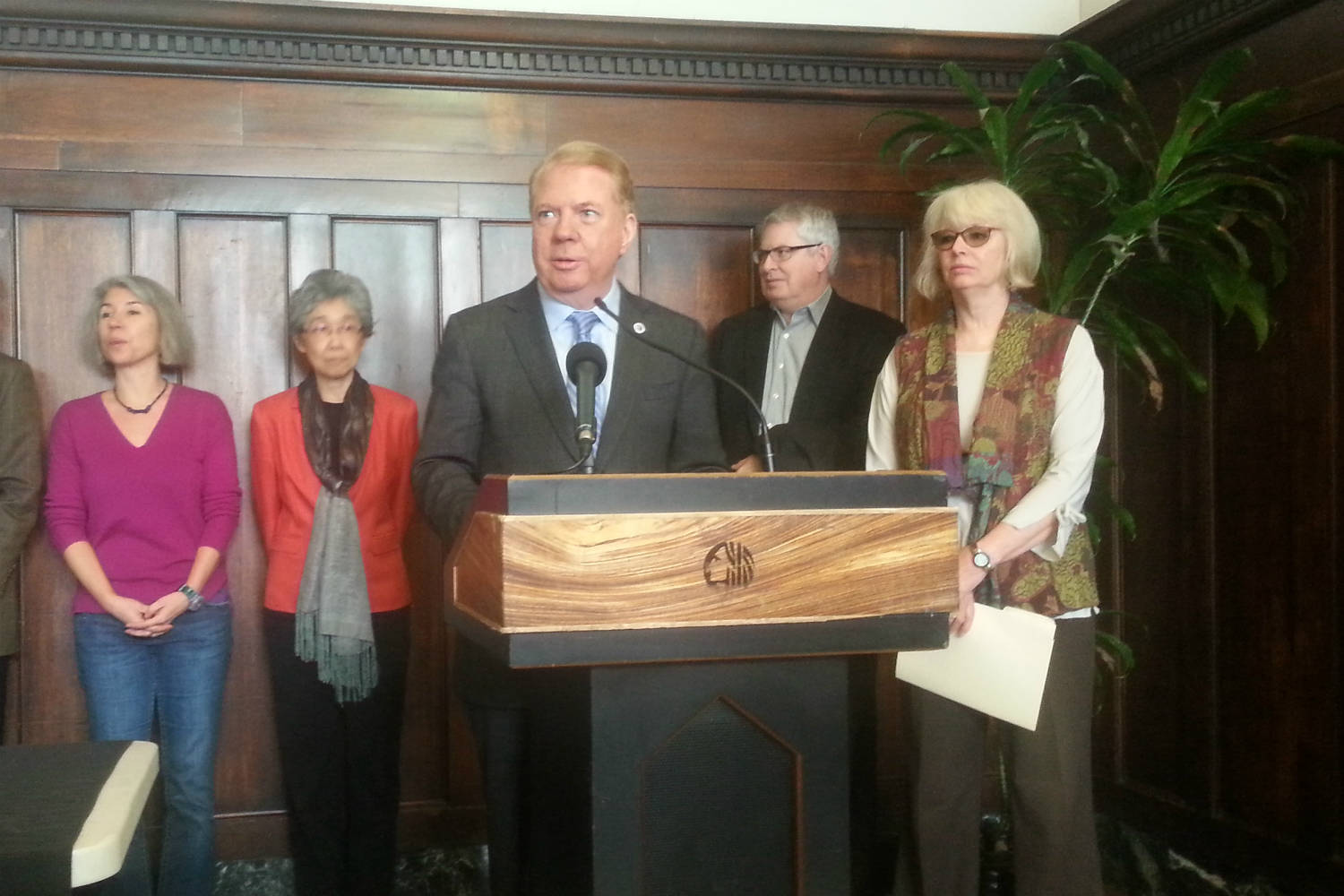 Mayor Ed Murray speaks in the Bush Hotel lobby, with councilmember Sally Bagshaw (far right). Photo by Casey Jaywork.