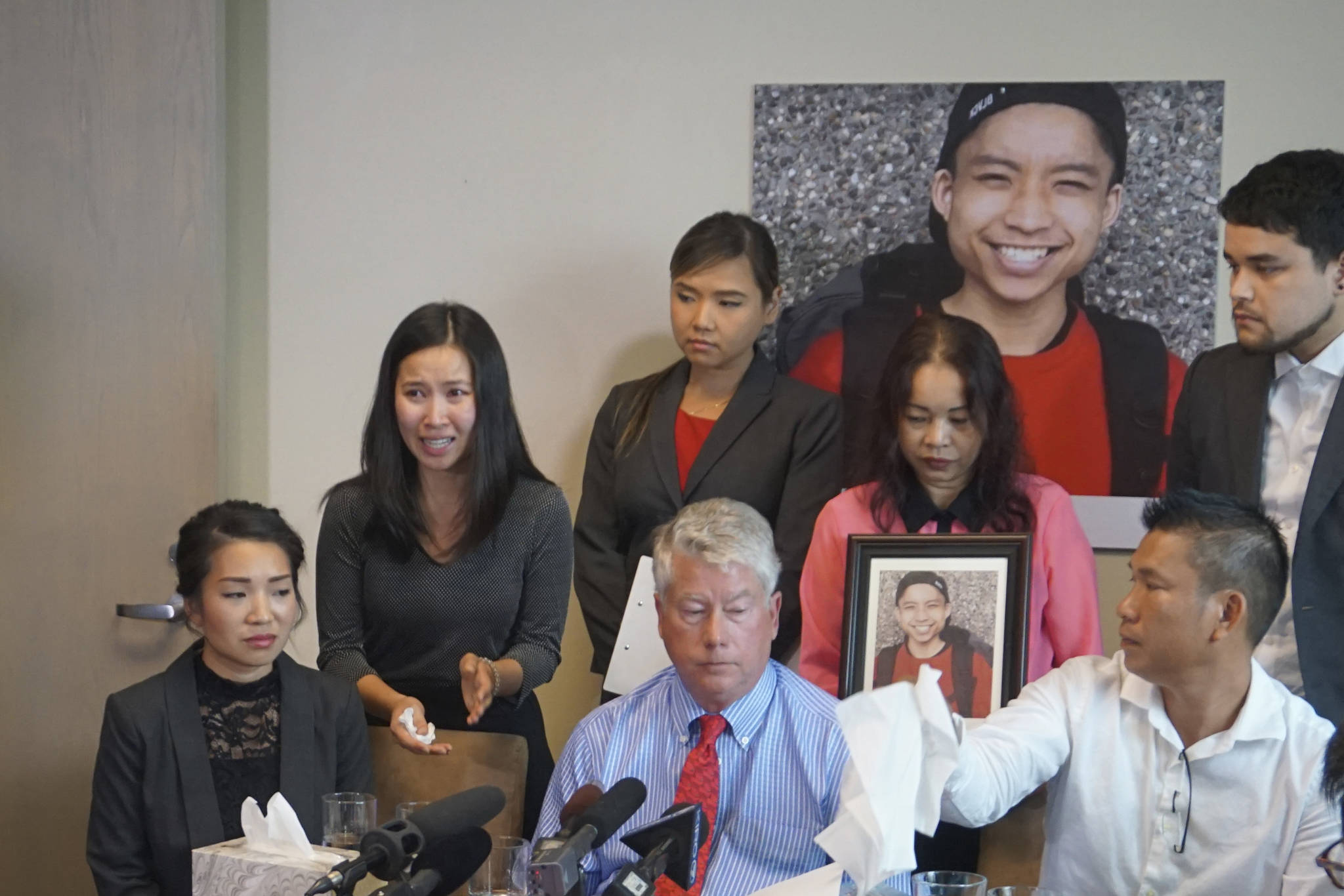 Tommy Le’s family, joined by their lawyers, discuss autopsy results. Photo by Daniel Person