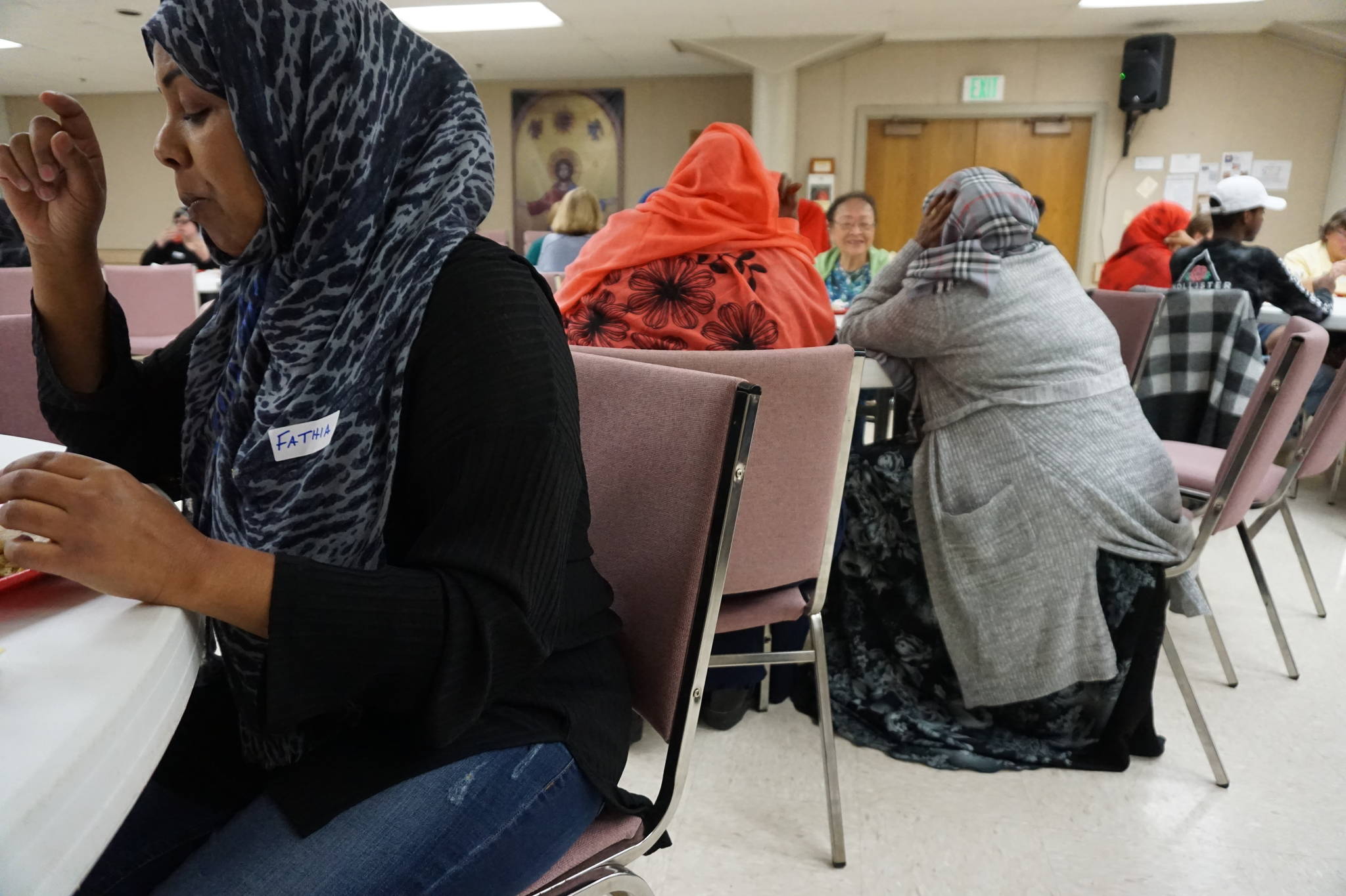 Attendees dig in at Eat With Muslims in Kent Friday night. Photo by Daniel Person