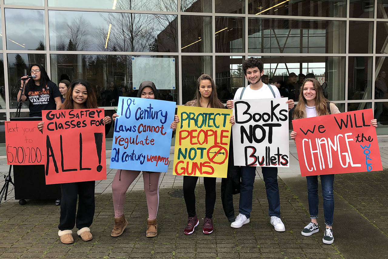 Students at Bellevue High School held signs during a walkout calling on legislators and Congress to enact “common sense” gun control laws. Photo courtesy of Bellevue School District