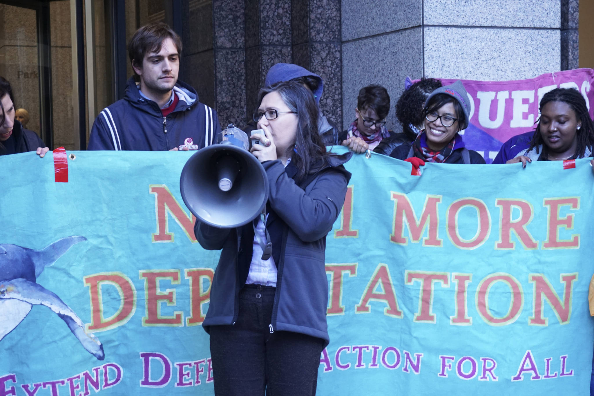 Maru Mora Villalpando stands outside of the Seattle Immigration Court after her first deportation hearing on March 15, 2018. Photo by Melissa Hellmann