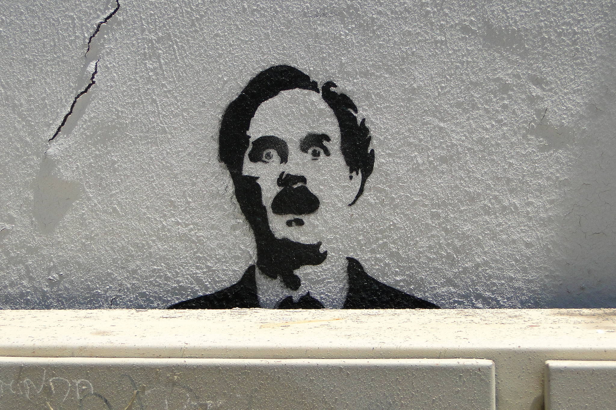 When your face gets stenciled on a wall in Lisbon, you know you’ve made it: John Cleese, in a &lt;em&gt;Fawlty Towers&lt;/em&gt; image. Photo via Wikimedia Commons