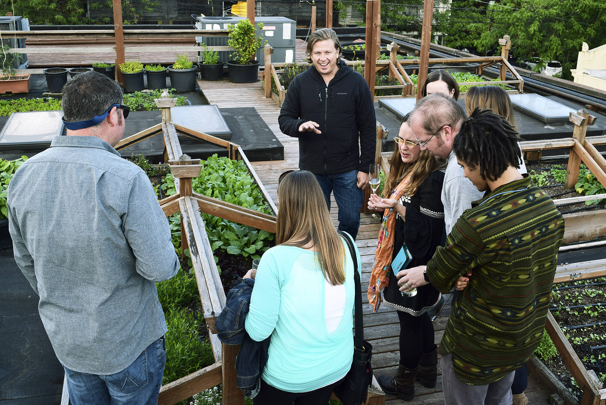 Chef Jason Stoneburner gives diners the lay of the land during a Bastille Rooftop Garden Dinner. 
Courtesy of Bastille Café & Bar
