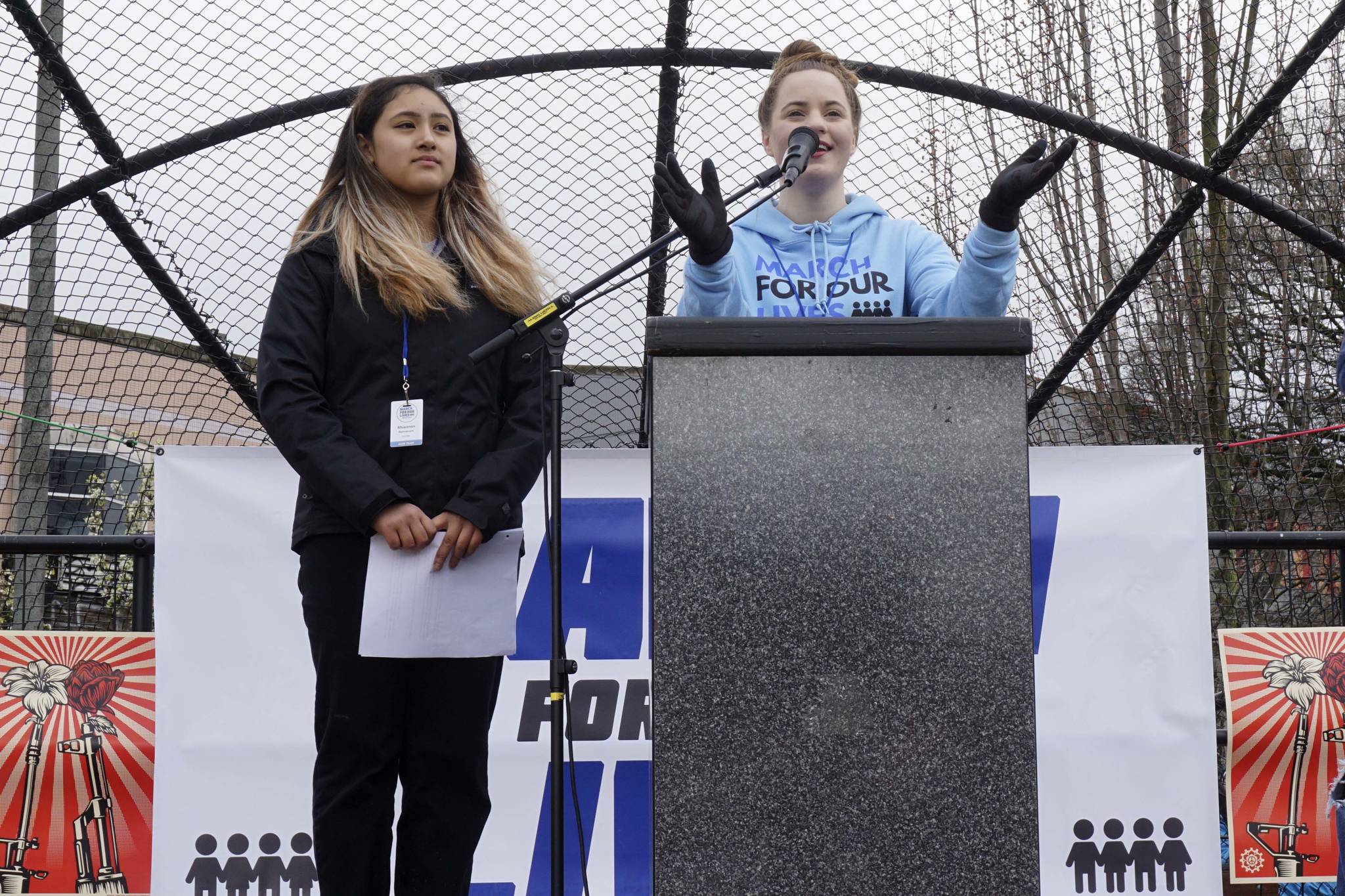 March for Our Lives Seattle founders Emilia Allard (right) and Rhiannon Rasaretnam (left) spoke at the rally on March 24, 2018. Photo by Melissa Hellmann