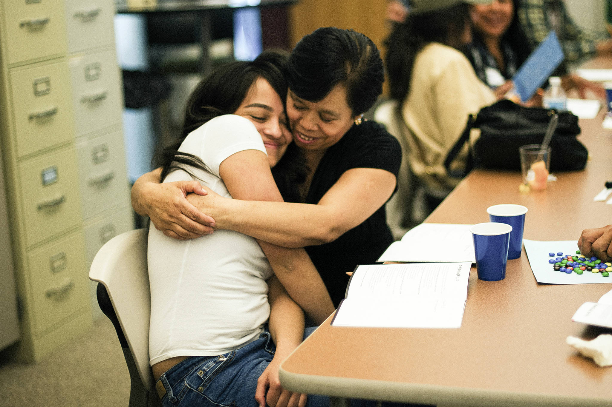 A parent hugs her teenage daughter while participating in Planned Parenthood’s LiFT program. Photo courtesy Planned Parenthood of the Great Northwest and the Hawaiian Islands
