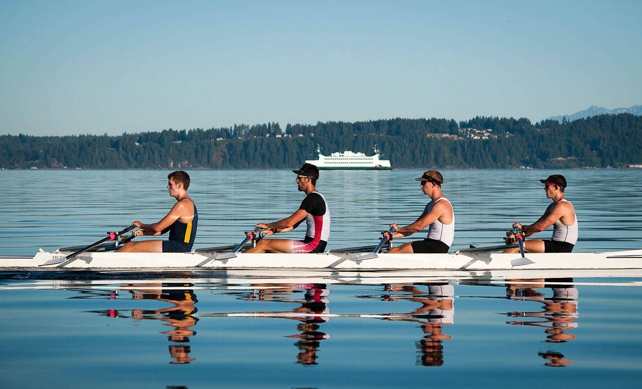 Vashion Island Rowers Jacob Plihal and Baxter Call (second from left and far right) train for the World Rowing Under 23 Championships on the water between Quartermaster Harbor and Point Defiance. Photo by Christine Plihal