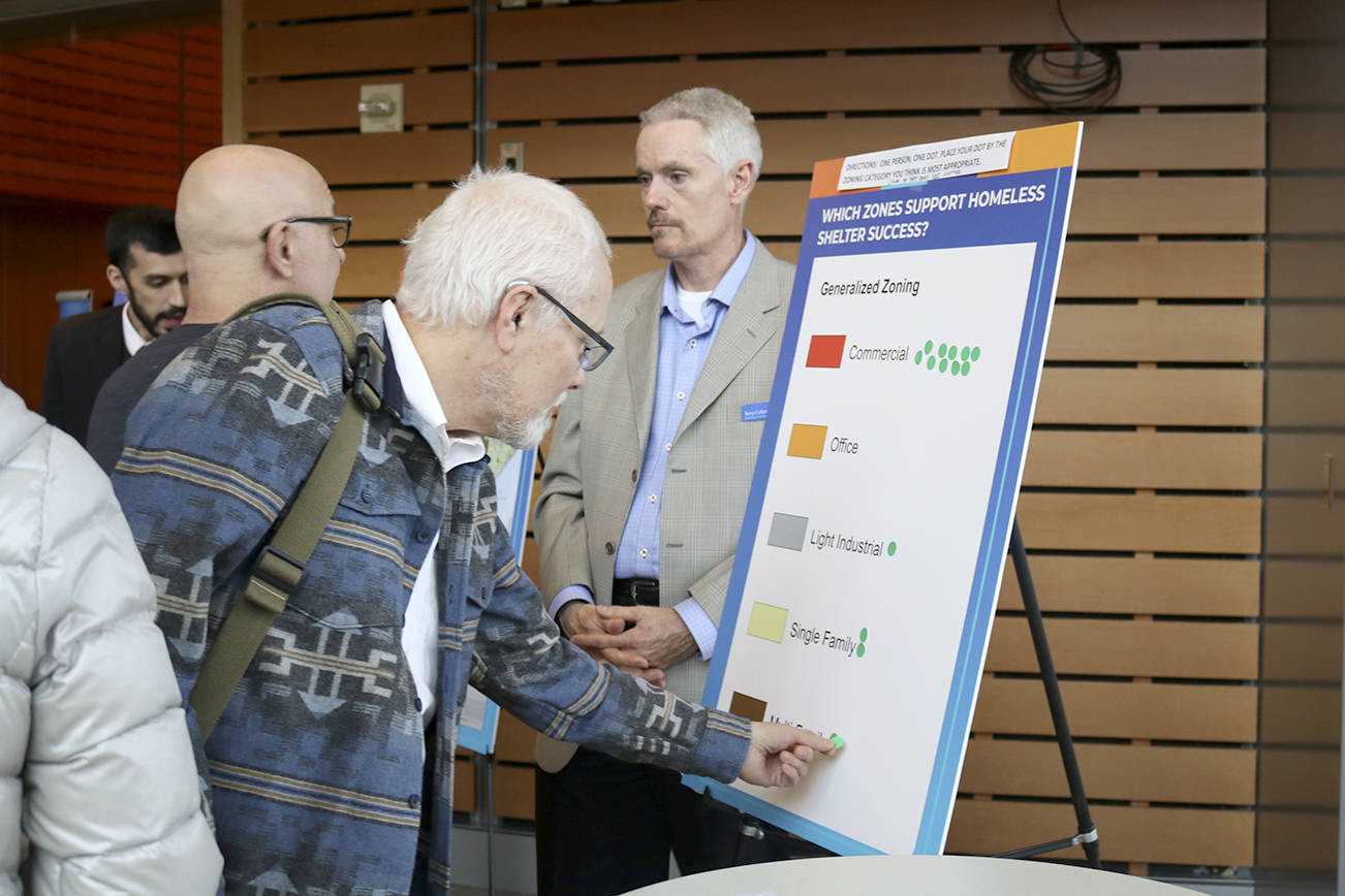 Prior to the City Council’s vote, Bellevue community members were able to place votes 
on what type of zoning homeless shelters should be located in. Evan Pappas/Staff Photo