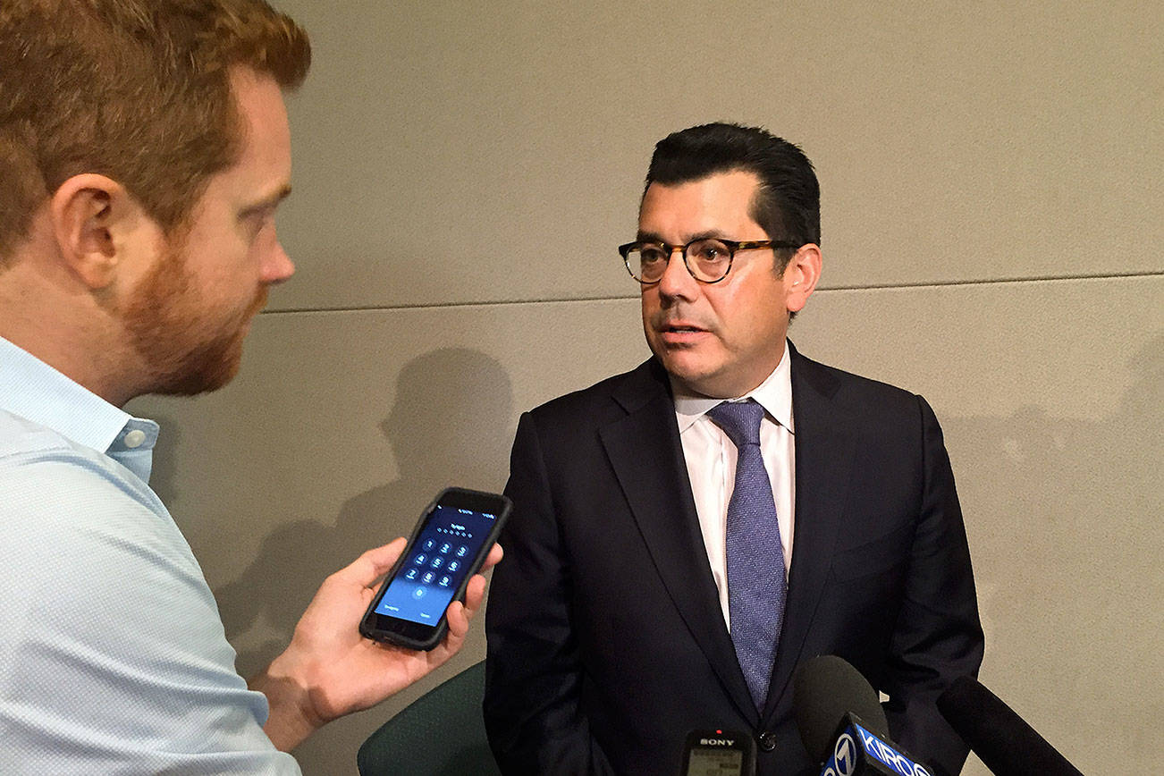 Fred Rivera, executive vice president and general counsel for the Seattle Mariners, takes questions from reporters after the July 30 hearing. Photo by Josh Kelety
