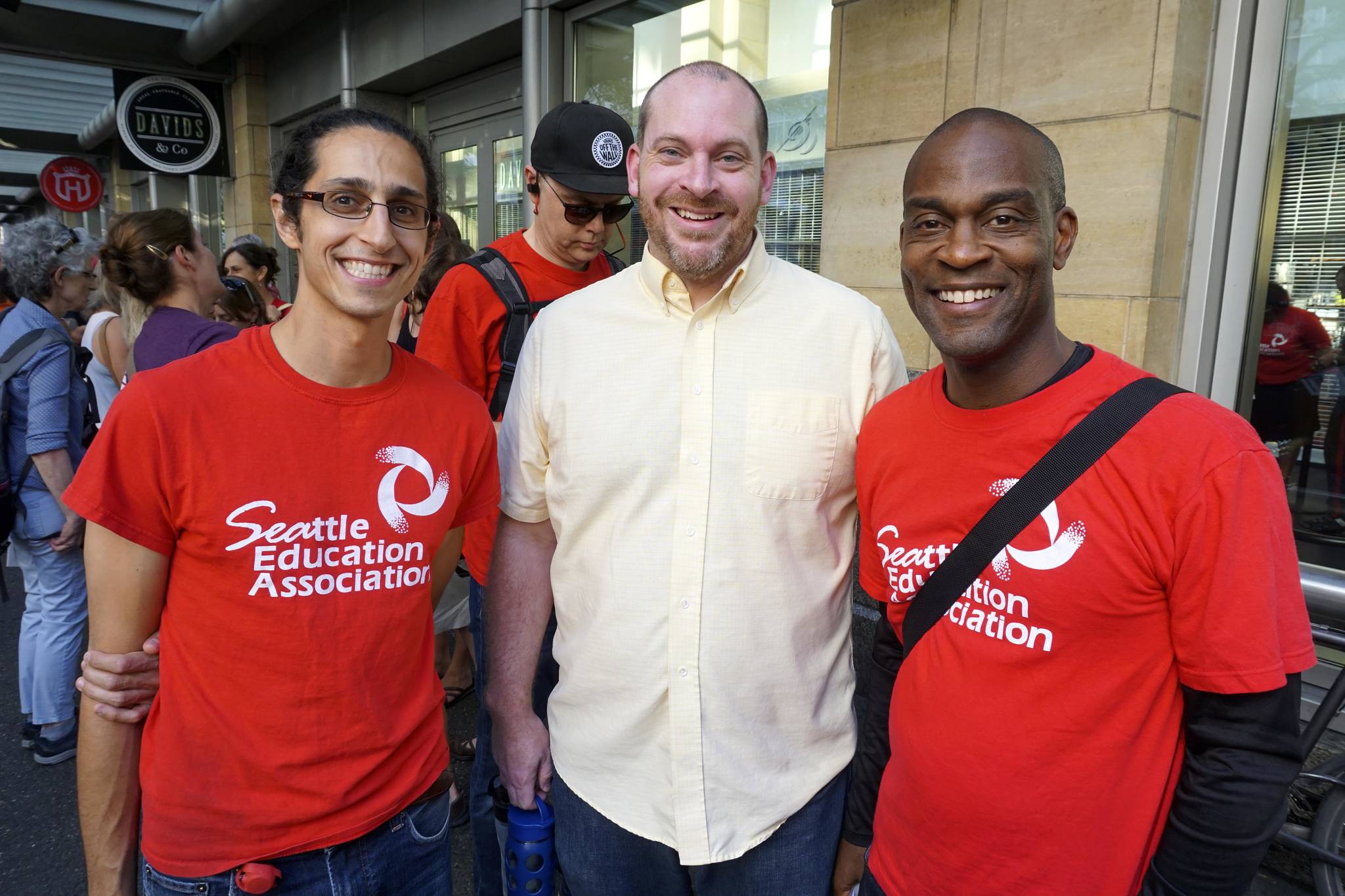 Greg DiGiacomo, Judson Kane, and Darryl James (left to right) attend a Seattle Education Association meeting at Benaroya Hall to vote for a strike authorization on Aug. 28, 2018. Photo by Melissa Hellmann