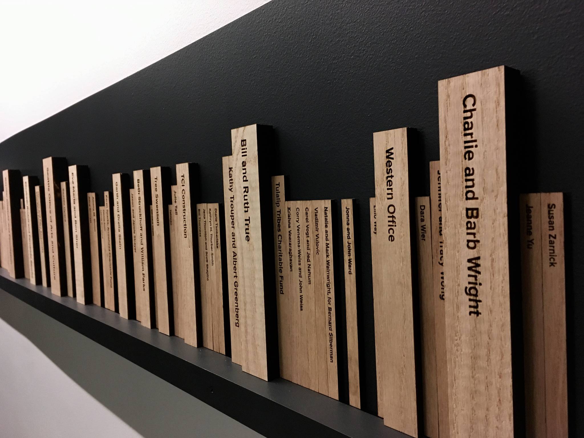 Donor books spines line the walls of the new Hugo House. Photo by Seth Sommerfeld