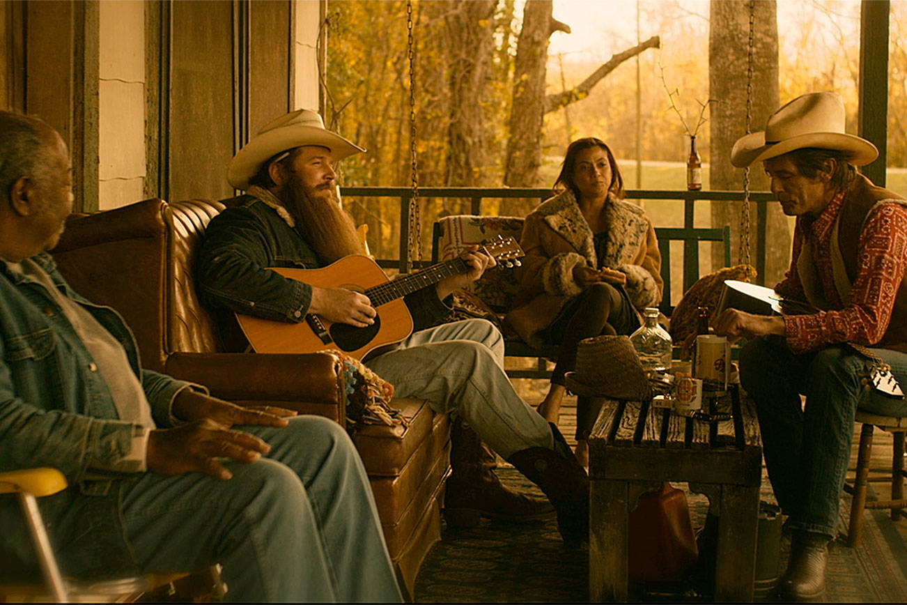 First-time actor Ben Dickey (with guitar) stars as the titular country songwriter Blaze Foley. Courtesy IFC Films