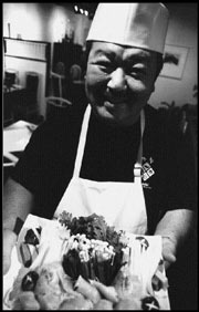 Hello! Ken Yamamoto, smiling with sushi.