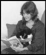 The Cat in the Lap: avid reader.