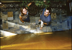 Mollie and Mark Huppert in their slate-tiled atrium.