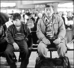Jamal Udin Torabi (left) and Enayatullah wait for the westward bus.
