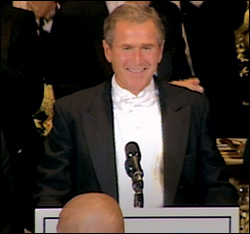 Dubya cracks wise at a fund-raising dinner. The shock is that he's funnier than Moore.