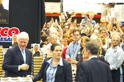 At the flagship Costco warehouse in Issaquah, former President Bill Clinton is greeted by a large crowd at a book-signing event.