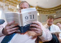 WASHINGTON - JULY 22:  Reporters read copies of the newly released 911 Commission's report, July 22, 2004 in Washington, DC. The commission investigated the intelligence failures leading up to the terrorist attacks on September 11, 2001 and gives recommendations to prevent further attacks.  (Photo by Mark Wilson/Getty Images)