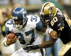 Bruised but not shaken: Shaun Alexander during one of his 28 carries.
