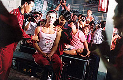 Suwan fights like a man to become a woman in Boxer.