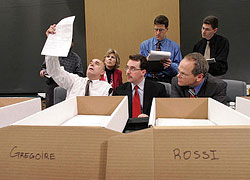 Dec. 20, 2004: King County Elections Director Dean Logan (front center) and prosecutor's office chief of staff Dan Satterberg (right) watch as County Council member Dwight Pelz holds up a ballot to determine a voter's intent during a gubernatorial election recount. The three comprise the King County Canvassing Board. Observing from behind are Republican Diane Tebelius (left), Democrat Will Rava (center), and Libertarian Brad Henry.