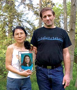 Su and Arnold Wilson of Kenmore, with a photo of their deceased daughter, Megan.