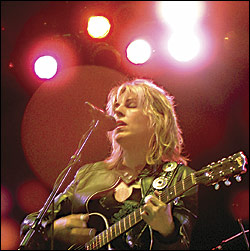 Lucinda Williams was smart. She wore a leather jacket to the chilly Summer Nights at South Lake Union opener.