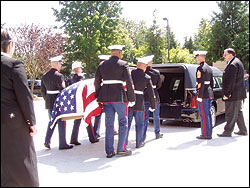 Nick Bloem's casket is loaded for the drive to Tahoma National Cemetery.