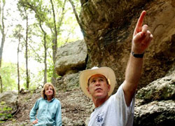 The nominee with the president on his ranch in 2002.