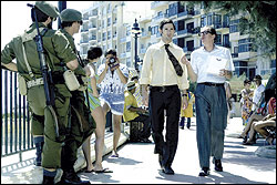 Bana (center) becomes the weapon of his Mossad handler (Geoffrey Rush).