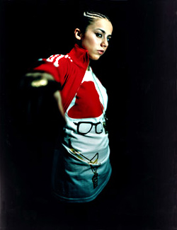 White midget against a black background: Lady Sovereign.