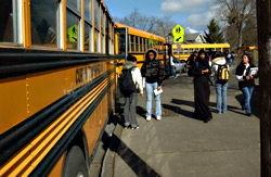 Students and yellow buses at Franklin High School.