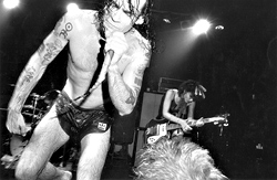 A young Henry Rollins performs.