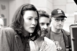 Blanchett on set with Soderbergh at far right.