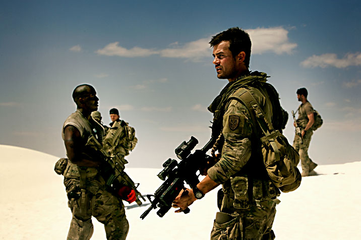 Soldiers Tyrese Gibson (left) and Josh Duhamel search for robot ass to kick.