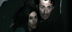 Olivia Bonamy and Micha&euml;l Cohen cower in the dark.