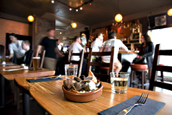 Una tapa with cien clams at Ocho bar.